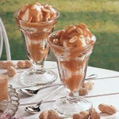 there are some desserts on the table and one is in glass cups with saucers