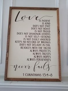 a wooden framed sign that says love is patient does not