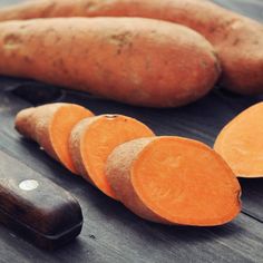 some carrots are sitting on a cutting board