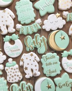 baby shower cookies are arranged on a table