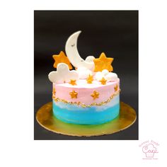 a cake decorated with stars and moon on a plate