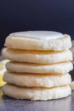 a stack of lemon shortbread cookies on top of a table