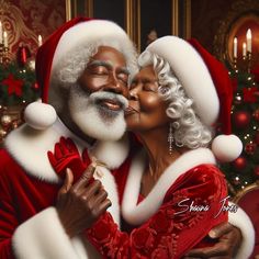 a man and woman dressed as santa claus kissing in front of a christmas tree with lights