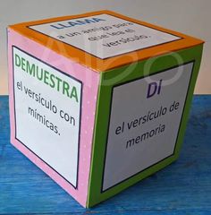 a box that is sitting on top of a wooden table with spanish words in it