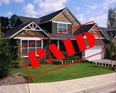 this is an image of a house for sale with a red sold sign in the foreground