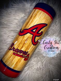 the atlanta braves logo is painted on this wooden tube