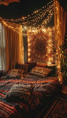 a bed covered in blankets and lights next to a window