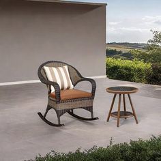 a chair and table sitting on a patio