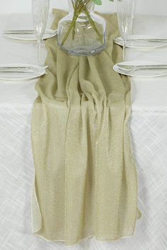 Introducing the Champagne sparkling glitter gauze table runner, a stunning addition to your event decor. Measuring 27"x120", this table runner is designed to infuse a touch of shimmering elegance into any setting. The glitter-infused gauze catches the light beautifully, creating a captivating display that will leave your guests in awe. Whether you’re planning a wedding, an anniversary party, or a holiday dinner, this table runner is the perfect accessory to elevate your decor. Sheer Table Runner, Wedding Arch Draping, Arch Draping, Gauze Table Runner, Sash Window, Chair Sash, Anniversary Dinner