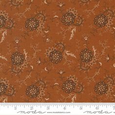 an orange and brown floral print fabric