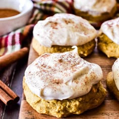 pumpkin spiced biscuits on a cutting board with cinnamon sticks