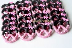 pink and black pretzels with bows on them