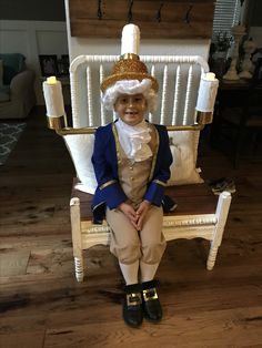 a small child sitting in a rocking chair