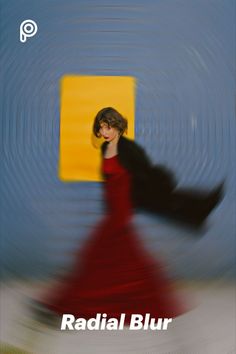 a blurry photo of a woman in a red dress