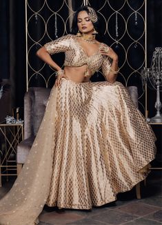 Featuring a beautiful array of elaborately embellished silk lehenga which proudly represents brilliance of extensive zardozi work, each intricate design spilling down its luxurious length lives forever in your wardrobe! The dazzle lehenga is paired with an intricately embroidered choli and alluring dupatta. Color -Golden Fabric & Work Style -- Silk fabric with intricate embroidery.- Embroidered zardozi work.- Net dupatta. Details -- Assured quality.- Wash care instruction: Dry clean only.- Sligh Indian Bridal Couture, Abhinav Mishra, Mirror Work Lehenga, Zardozi Work, Indian Designer Suits, Silk Lehenga, Work Style, Net Dupatta, Bridal Lehenga