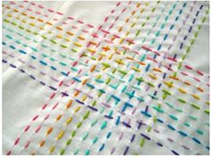 a white cloth with multicolored lines on it