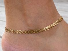 "Chevron Chain Anklet ♡ PRODUCT DETAILS: - High quality gold stainless steel plated chain - Chain is 6.5mm in width - Lobster claw clasp - Personalize it with custom initial disc - Come with 1\" extender (additional length) - Packed in a drawstring bag that is ready to give - Waterproof - Tarnish resistant - Hypoallergenic (can be worn 24/7) SIZING: Please wrap a string around your ankle to find out the right size for you (length includes the chain, jump rings, and the closure). Apply the length you have got with a string over a tape measure or ruler. Choose your size from the drop-down menu. If you can't see your size, please choose a \"custom\" and leave me a note at the checkout. Check out other chain anklets: https://www.etsy.com/shop/SeaSideMotifs?ref=seller-platform-mcnav&section_id= Anklet Jewelry Gold, Womens Ankle Bracelets, Gold Chevron, Sea Side, Gold Anklet, Foot Jewelry, Chain Anklet, Anklet Jewelry, Body Jewellery