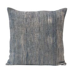 a blue and white striped pillow on a white background