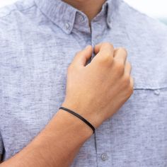 Showcase masculine elegance with our Men's Black Cord Bracelet. Expertly crafted from durable, waterproof waxed nylon, it's designed for both style and endurance. The deep black hue is versatile, perfect for any look, from casual to formal. Adjustable to fit wrist sizes 5" to 10" inches, it provides a comfortable, secure fit for all. Choose from 1mm (Thin) 1.5mm (Standard) 2mm (Bold) and 3mm (Extra Bold) thicknesses. Masculine Elegance, Bracelet Pack, Cord Bracelet, Anklet Bracelet, Cord Bracelets, Crystal Charm, Deep Black, Glass Necklace, The Deep