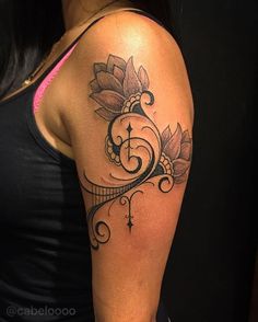 a woman with a tattoo on her arm