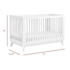 a white crib is shown with measurements for the bed and side rails on it