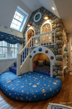 a kid's room with a bed and stairs