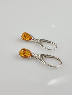 Little teardrop shape Amber earrings. Total length 3 cm drop size 1.2 cm. Sterling silver 925. With hallmarks. Leaverback. Colour might be sightly darker than in a photo. This item was made of natural Baltic Amber. All the amber used in my jewelry is collected in my home country Lithuania. I sell only genuine, real, not pressed, authentic, natural Baltic Amber. Item may have natural imperfections. Due to amber being natural, each of my jewelry is unique and even the same models can be slightly d Hypoallergenic Amber Teardrop Earrings, Hypoallergenic Amber Teardrop Jewelry, Teardrop Baltic Amber Earrings In Amber, Teardrop Baltic Amber Earrings, Amber Teardrop Baltic Amber Earrings, Baltic Amber Dangle Earrings, Hypoallergenic Amber Sterling Silver Earrings, Amber Sterling Silver Drop Earrings, Silver Baltic Amber Earrings