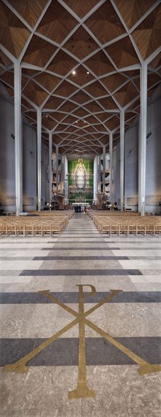 an empty church with rows of chairs and pews on the floor in front of it