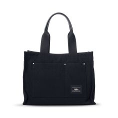 From trips to the beach to running errands with your little ones, this premium bag was built for those who do it all. The Runabout Open Tote is crafted from washed twill canvas, inspired by the durability of traditional gardening and tool bags. Padded leather handles elevate the look while its added length makes carrying it over your shoulder a breeze. | Shinola Runabout Open Tote Bag In Black Canvas Tool Bags, Travel Companion, Waxed Canvas, Small Accessories, Black Canvas, Canvas Leather, Leather Care, Leather Wraps, Running Errands