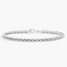 This lightweight wheat bracelet can be worn on its own or stacked with other pieces from your collection. This bracelet is made with finely polished 14k white gold. Classic White Gold Charm Bracelet With Silver Chain, Elegant Sterling Silver Wheat Chain Bracelet, Classic White Gold Charm Bracelet With Sterling Silver Clasp, Classic White Gold Charm Bracelet With Silver Clasp, Classic Silver Wheat Chain Bracelet, Classic White Gold Chain Bracelet With Lobster Clasp, Classic Wheat Chain Bracelet As Gift, Classic Wheat Chain Bracelet For Gift, Classic Wheat Chain Link Bracelet