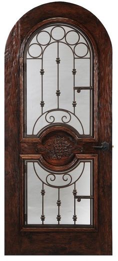 an ornate wooden door with glass panels