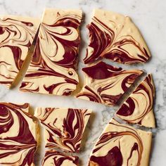 pieces of swirled cheesecake sitting on top of a marble counter