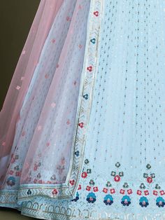 Get ready to steal the show with our beautiful adorable sky blue embroidery georgette wedding wear lehenga choli. Made with heavy georgette material, this lehenga choli is semi stitched up to 42 inches and comes with a pink net dupatta with sequins and embroidered borderwork. The dreamy sky blue color, sequins work, and thread embroidery add a touch of glamour to this exquisite piece. Perfect for weddings, festivals, and receptions, this gorgeous outfit is sure to turn heads. Additionally, it is Dreamy Sky, Ghaghra Choli, Georgette Material, Bridesmaid Lehenga, Georgette Lehenga, Hair Inspiration Long, Indian Party, Blue Lehenga