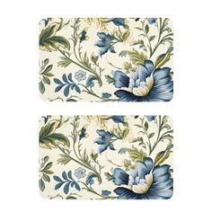 two place mats with blue flowers and leaves on white background, one has an image of the