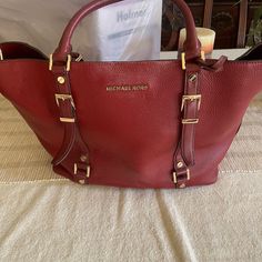 Red Mk Purse. Classic Bag . Matching Wallet For Additional $50. Excellent Condition No Wear No Stains. New Condition Red Leather Satchel With Branded Hardware, Red Luxury Satchel With Leather Handles, Luxury Red Satchel With Leather Handles, Red Leather-handled Satchel For Formal Occasions, Elegant Red Satchel With Leather Handles, Designer Red Satchel For Travel, Red Leather Bag With Branded Hardware, Designer Red Satchel With Gold-tone Hardware, Designer Burgundy Shoulder Bag With Branded Hardware