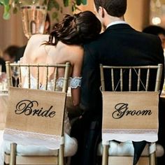 the bride and groom are sitting in their chairs