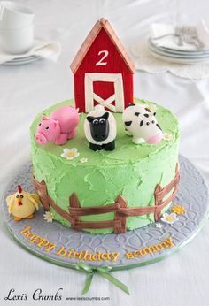 a birthday cake with farm animals on it