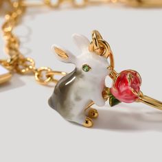 Unlock the secret of timeless style with Secret Garden Rabbit Bracelet. Meticulously crafted with an elegant poker charm and subtly lustrous enamel, this exquisite adornment is the epitome of tasteful luxury. A heartfelt addition to any jewelry collection. DETAILS Plating: 18K Gold Materials: 18K Gold on Brass Size:  8.03 "/20.4cm Weight:  10.1g Hypoallergenic design Elegant Enamel Jewelry With Lobster Clasp, Luxury Jewelry With Dangling Charms For Gifts, Luxury Dangling Charms Jewelry For Gifts, Luxury Dangling Charms Jewelry Gift, Elegant Rose Gold Enamel Jewelry, Luxury Vintage Charm Bracelet As Gift, Rose Gold Enamel Charms Jewelry, Valentine's Day Enamel Charms Jewelry, Valentine's Day Enamel Jewelry With Charms