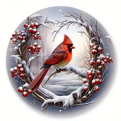 a red bird sitting on top of a tree branch covered in snow and berry berries