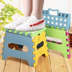 two children's shoes sitting on top of colorful stools