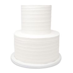 a three tiered white cake sitting on top of a plate