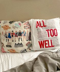 a pillow with the words all too well on it sitting on top of a bed