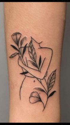 a small rose tattoo on the leg