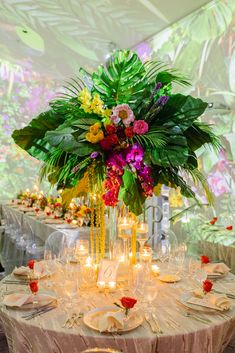 the table is set with candles and flowers