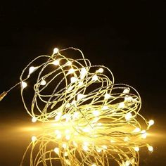 a string of white lights on a black background