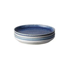 three blue and white plates stacked on top of each other