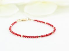 This red minimalist bracelet made of tiny red coral and faceted natural gold polished hematite stones.Simple and timeless. Materials - 2.2-2.3 mm round red coral stones. - 2.5 mm gold filled beads - 14K gold filled clasp.Spring ring clasp OR Lobster claw clasp. Please see last picture and select the one you like using the drop down menu. Bracelet Length Options - from 6.5 to 8.5 inches If you prefer smaller or larger size, please contact me about custom sizing. The necklace will be packed in a j Minimalist Red Beaded Bracelet With Tiny Beads, Dainty Red Beaded Bracelets With Tiny Beads, Red Faceted Beaded Bracelets For Gifts, Red Beaded Dainty Bracelets, Red Faceted Round Bead Bracelets, Red Minimalist, Black Spinel Bracelet, Red Bracelet, Bracelet Stacking