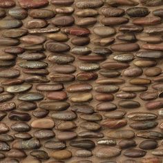 a wall made up of rocks and pebbles