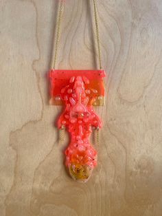 One of a kind hot pink pendant sculpted from recycled plastic, acrylic, resin and glue on a gold-plated chain.  All necklaces come in pre-made lengths designed to fit most people, but if you have a specific length in mind, please message me and I'm happy to accommodate! Pink Resin Party Necklaces, Pink Necklace With Large Pendant, Unique Pink Necklace With Large Pendant, Pink Plastic Necklaces As Gifts, Pink Plastic Necklace For Gift, Pink Plastic Necklace Gift, Handmade Pink Plastic Necklace, Pink Resin Pendant Necklace, Pink Plastic Party Necklace