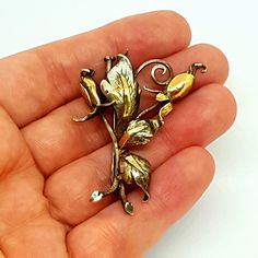 Beautiful and stylish corsage brooch ideal for lapel, scarf or hat. Made in silver and gold. Circa 1950. Dimensions: Long it measures approximately 46.7 mm and wide it is 34.9 mm wide (by the highest part). Weight: Its weight is 8.75 grams. Composition: 925 silver, without seal, acid test. To see photos. The condition is good, with signs of wear. It is not new, please see the photos, which are an important part of the description. See the photos for your own impression (note that the photos were Mid-century Yellow Gold Brooch For Gifts, Vintage Yellow Gold Enamel Pin, Vintage Gold Enamel Pin For Wedding, Gold Vintage Enamel Pin For Wedding, Art Nouveau Gold Brooches As Gift, Gold Art Nouveau Brooches For Gift, Vintage Yellow Gold Lapel Pin As A Gift, Vintage Enamel Brooch Pin For Anniversary, Vintage Yellow Gold Lapel Pin For Gift